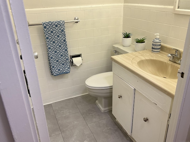 25 Cartright St Unit 1E, Bridgeport, CT 06604 - half bath with vanity, tile walls, and tile patterned floors