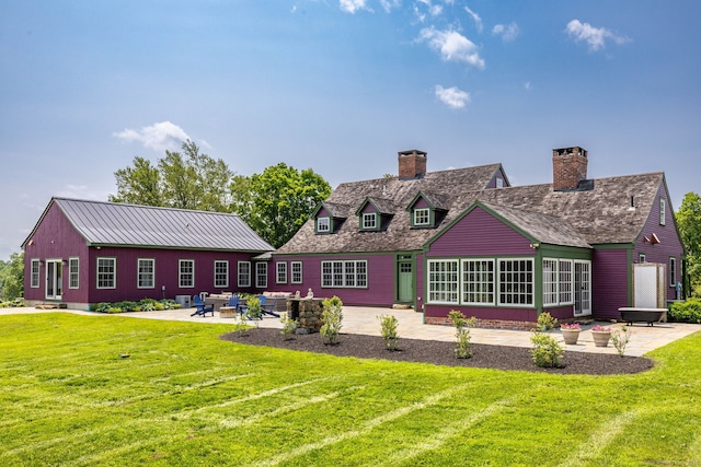93 Northfield Rd, Litchfield, CT 06759 - rear view of house with a patio area, a yard, and a chimney