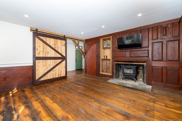 93 Northfield Rd, Litchfield, CT 06759 - unfurnished living room featuring a wood stove, dark wood finished floors, recessed lighting, a barn door, and baseboard heating