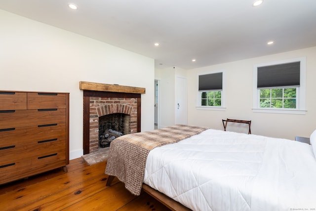 93 Northfield Rd, Litchfield, CT 06759 - bedroom featuring hardwood / wood-style floors, recessed lighting, and a brick fireplace