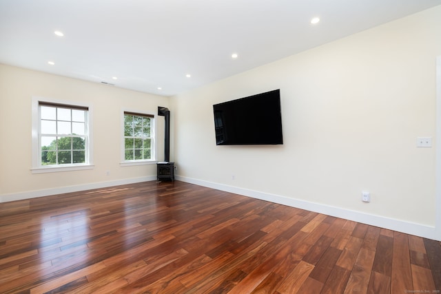 93 Northfield Rd, Litchfield, CT 06759 - spare room with wood finished floors, a wood stove, and recessed lighting