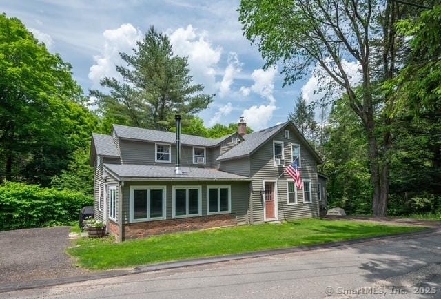 60 Pomperaug Rd, Woodbury, CT 06798 - traditional-style home featuring a chimney, a front lawn, and roof with shingles
