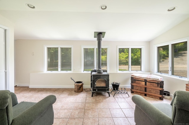 60 Pomperaug Rd, Woodbury, CT 06798 - sitting room with a wood stove, light tile patterned floors, and baseboards