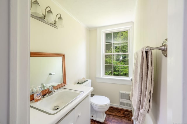 60 Pomperaug Rd, Woodbury, CT 06798 - half bath featuring vanity, healthy amount of natural light, wood finished floors, heating unit, and crown molding