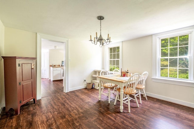 60 Pomperaug Rd, Woodbury, CT 06798 - dining area featuring dark wood-style flooring, a chandelier, baseboards, and plenty of natural light
