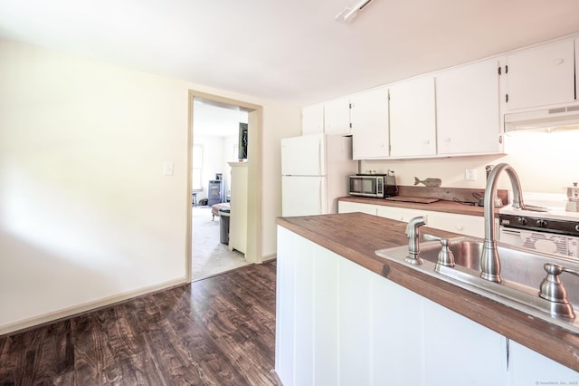 60 Pomperaug Rd, Woodbury, CT 06798 - kitchen featuring freestanding refrigerator, stainless steel microwave, custom exhaust hood, dark wood-style floors, and white cabinets