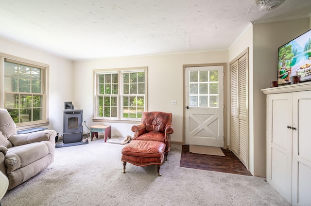 60 Pomperaug Rd, Woodbury, CT 06798 - living room featuring a wood stove, carpet floors, crown molding, and plenty of natural light