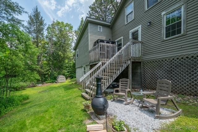 60 Pomperaug Rd, Woodbury, CT 06798 - back of house with a lawn, a storage shed, a wooden deck, and stairs