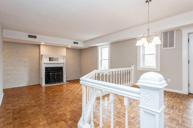 71A Imlay St Unit D2, Hartford, CT 06105 - corridor featuring a chandelier and brick wall