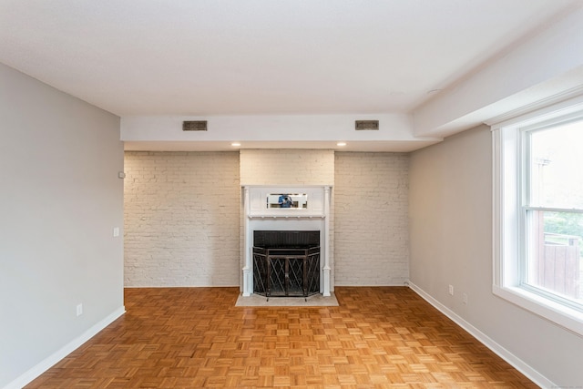 71A Imlay St Unit D2, Hartford, CT 06105 - unfurnished living room featuring a fireplace and brick wall