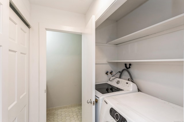 71A Imlay St Unit D2, Hartford, CT 06105 - laundry room featuring washer and clothes dryer and tile patterned flooring