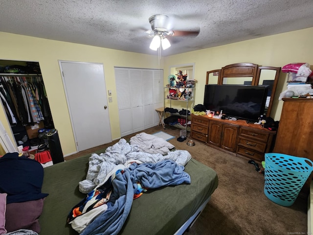 560 Yale Ave Unit 8, Meriden, CT 06450 - bedroom featuring carpet flooring, a textured ceiling, two closets, and a ceiling fan