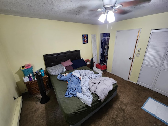 560 Yale Ave Unit 8, Meriden, CT 06450 - bedroom with carpet flooring, a baseboard heating unit, multiple closets, and a ceiling fan