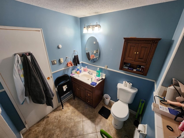 560 Yale Ave Unit 8, Meriden, CT 06450 - bathroom featuring vanity, a textured ceiling, and tile patterned floors