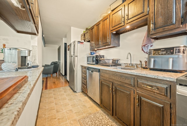 113E Country Squire Dr Unit 113E, Cromwell, CT 06416 - kitchen with stainless steel appliances, light stone counters, and light tile patterned floors