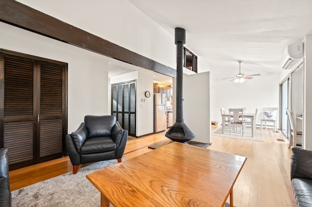 113E Country Squire Dr Unit 113E, Cromwell, CT 06416 - living area featuring ceiling fan, a wall unit AC, light wood-type flooring, and lofted ceiling