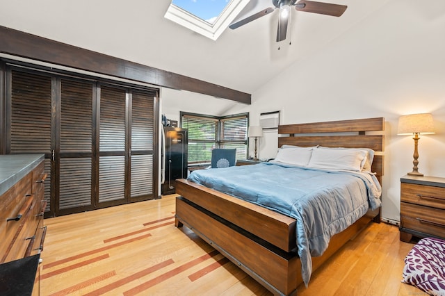 113E Country Squire Dr Unit 113E, Cromwell, CT 06416 - bedroom with light wood finished floors, a skylight, high vaulted ceiling, and a ceiling fan