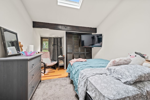 113E Country Squire Dr Unit 113E, Cromwell, CT 06416 - bedroom featuring a skylight, lofted ceiling, and wood finished floors