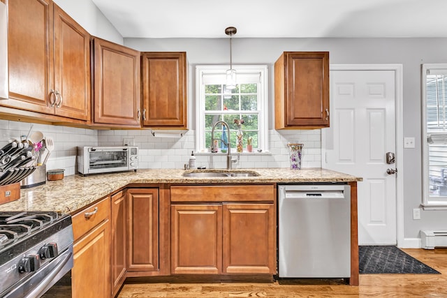 20 Oakland Ave Apt 3B, Danbury, CT 06810 - kitchen featuring stainless steel appliances, brown cabinetry, and light wood-type flooring