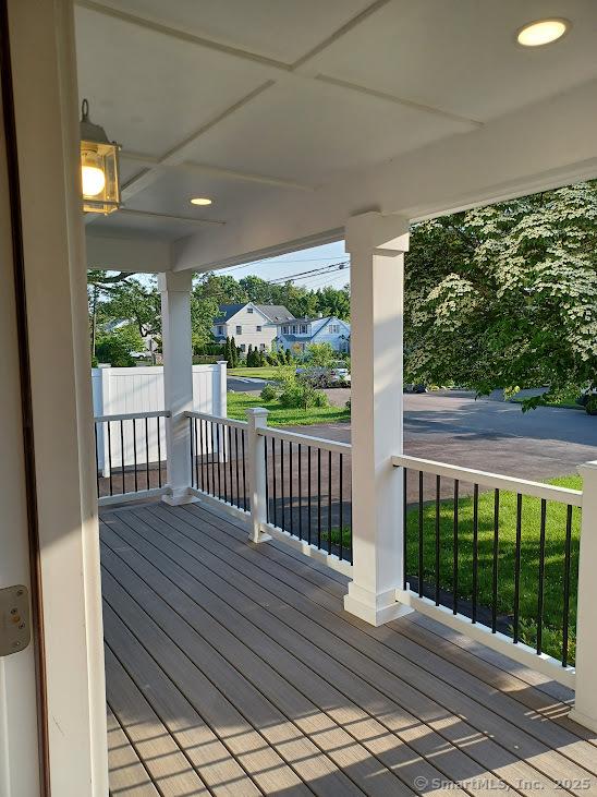 105 Houston Ter, Stamford, CT 06902 - wooden porch featuring a residential view