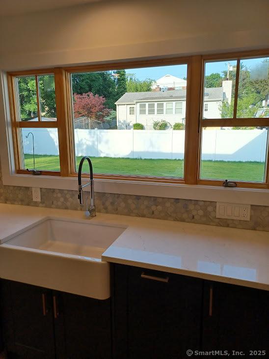105 Houston Ter, Stamford, CT 06902 - kitchen featuring light countertops and a sink