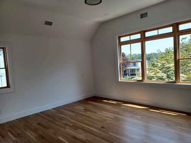105 Houston Ter, Stamford, CT 06902 - bonus room with vaulted ceiling, healthy amount of natural light, and wood finished floors