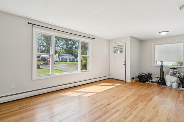 1105 Slater Rd, New Britain, CT 06053 - entryway with wood finished floors and baseboard heating