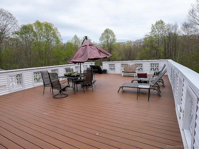 7 Hart Rd, Guilford, CT 06437 - deck with outdoor dining area and a forest view