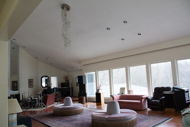 7 Hart Rd, Guilford, CT 06437 - living area with wood finished floors, plenty of natural light, lofted ceiling, and recessed lighting