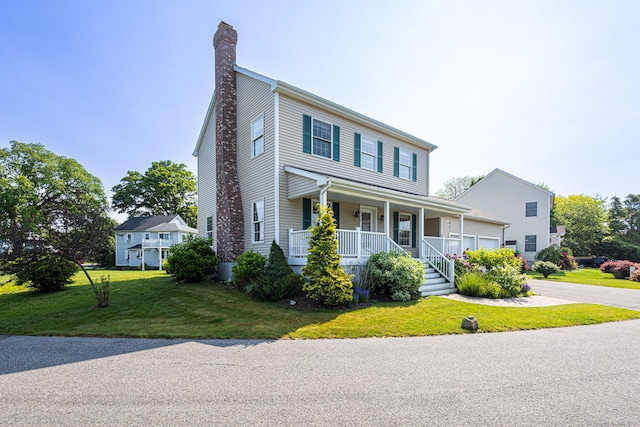 509 Main St Unit 6, Old Saybrook, CT 06475 - view of front of home with covered porch, a chimney, a front lawn, a garage, and driveway