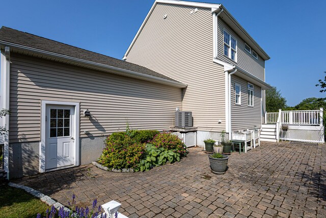 509 Main St Unit 6, Old Saybrook, CT 06475 - rear view of house featuring a wooden deck and a patio area