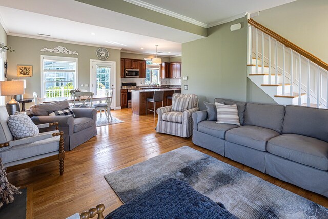 509 Main St Unit 6, Old Saybrook, CT 06475 - living area featuring light wood finished floors, ornamental molding, stairway, and recessed lighting