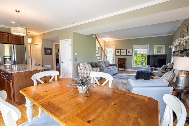 509 Main St Unit 6, Old Saybrook, CT 06475 - dining room with stairs, ornamental molding, and light wood-style flooring