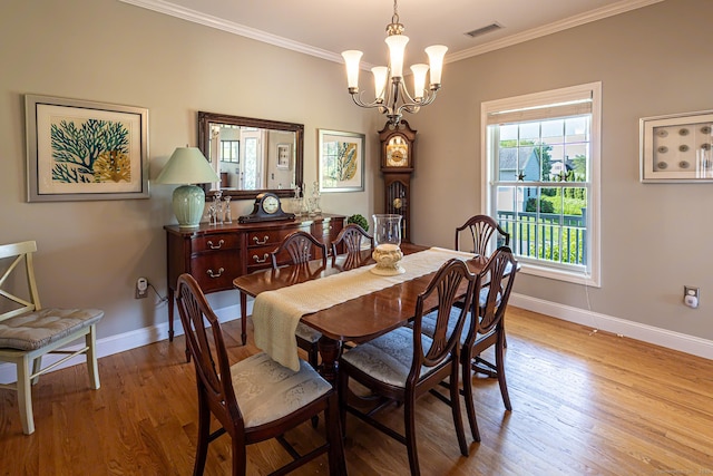 509 Main St Unit 6, Old Saybrook, CT 06475 - dining area featuring crown molding, wood finished floors, and a chandelier