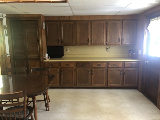 38 Upland Rd, Winchester, CT 06098 - kitchen featuring light countertops, a paneled ceiling, and light flooring
