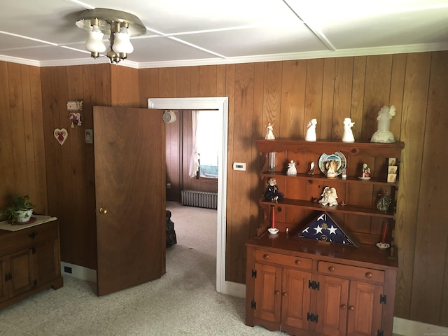 38 Upland Rd, Winchester, CT 06098 - hallway with radiator, wooden walls, a chandelier, and light carpet