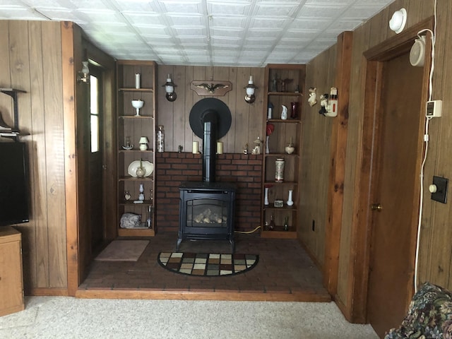 38 Upland Rd, Winchester, CT 06098 - living room featuring wooden walls and a wood stove