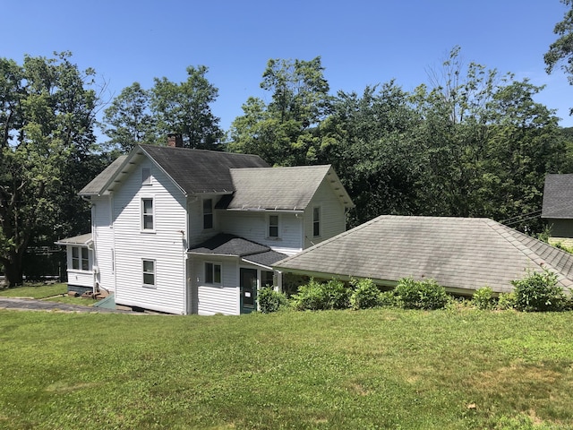 38 Upland Rd, Winchester, CT 06098 - view of front of house with a chimney, a front yard, and roof with shingles