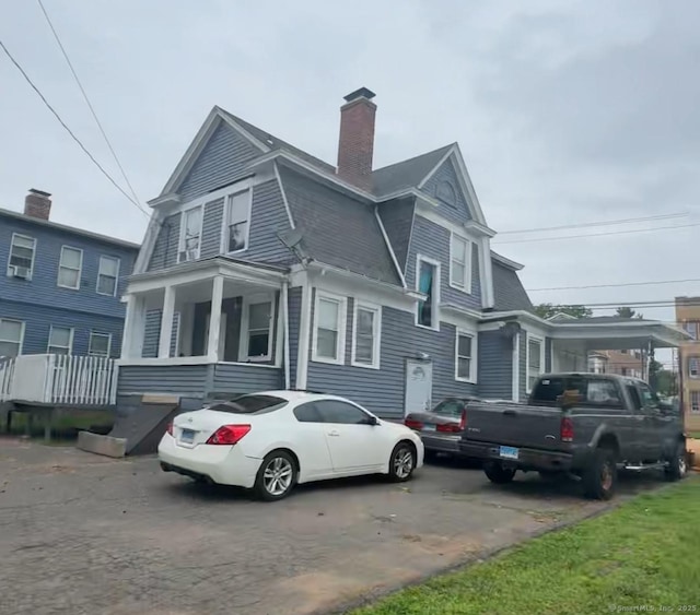453 Burnside Ave, East Hartford, CT 06108 - view of front facade featuring a chimney