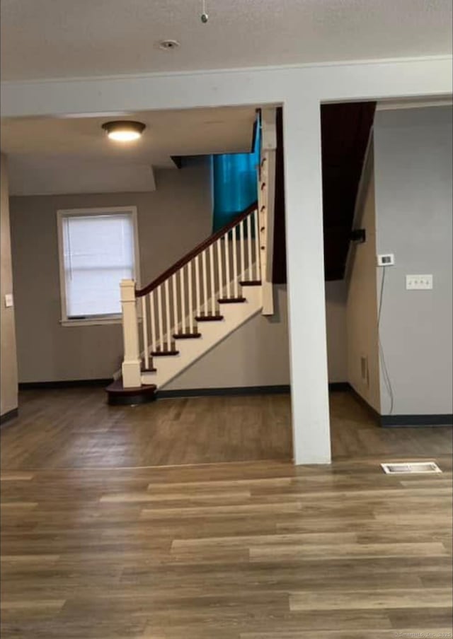 453 Burnside Ave, East Hartford, CT 06108 - staircase with wood finished floors and baseboards