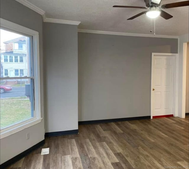 453 Burnside Ave, East Hartford, CT 06108 - spare room featuring wood finished floors, plenty of natural light, ceiling fan, and ornamental molding