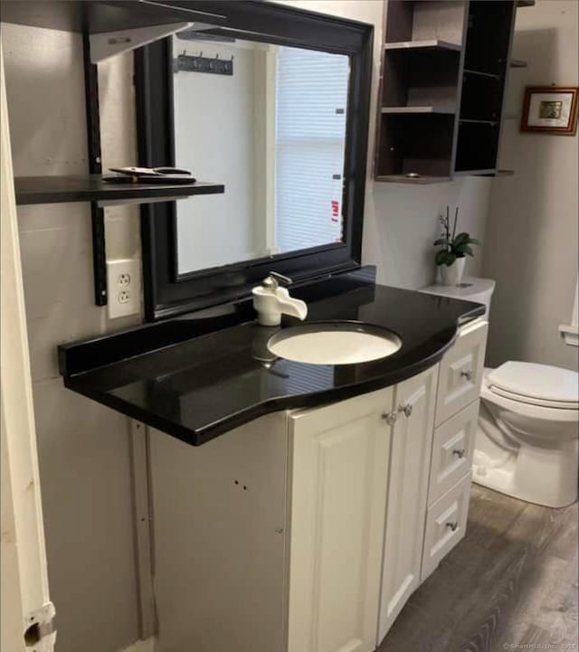 453 Burnside Ave, East Hartford, CT 06108 - half bath with wood finished floors and vanity