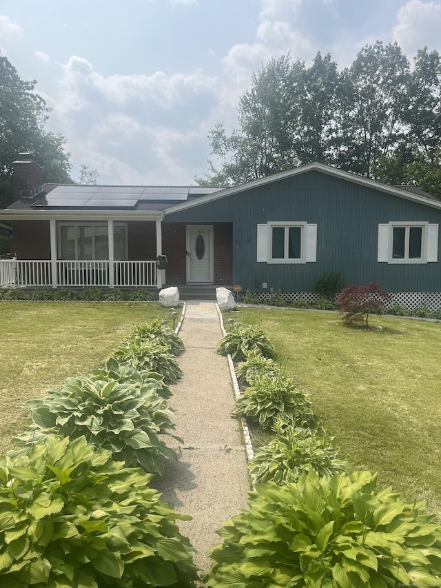 62 Haddad Rd, Waterbury, CT 06708 - view of front of property with a front yard, a porch, and a chimney