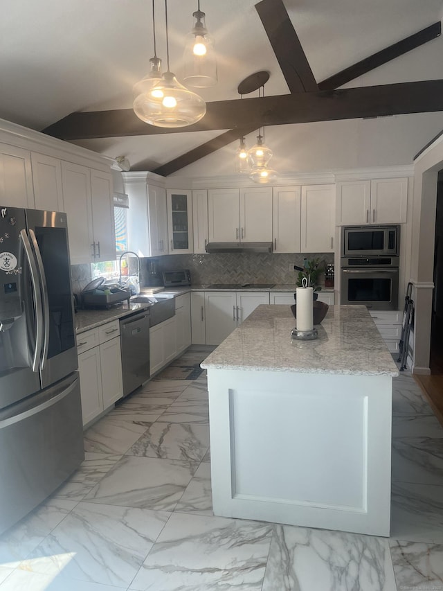 62 Haddad Rd, Waterbury, CT 06708 - kitchen featuring appliances with stainless steel finishes, backsplash, a kitchen island, light marble finish flooring, and white cabinetry