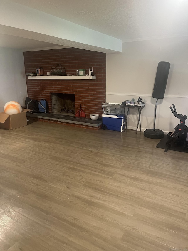62 Haddad Rd, Waterbury, CT 06708 - living area featuring wood finished floors and a fireplace