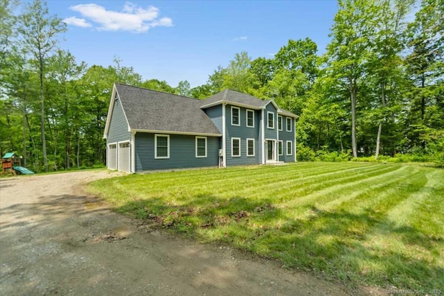 379 Tripp Hollow Rd, Brooklyn, CT 06234 - rear view of house featuring a garage, driveway, and a yard