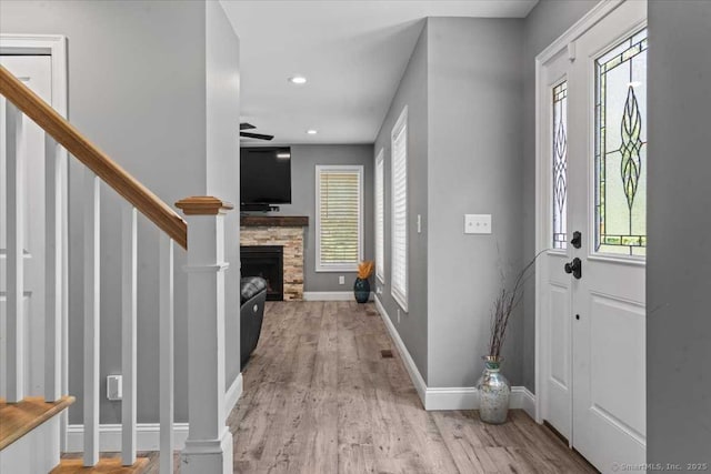 379 Tripp Hollow Rd, Brooklyn, CT 06234 - foyer entrance with wood finished floors, a fireplace, stairway, a ceiling fan, and recessed lighting