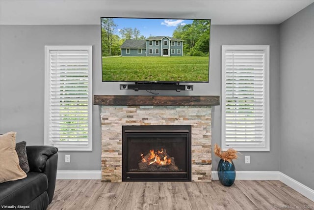 379 Tripp Hollow Rd, Brooklyn, CT 06234 - living area with wood finished floors and a stone fireplace
