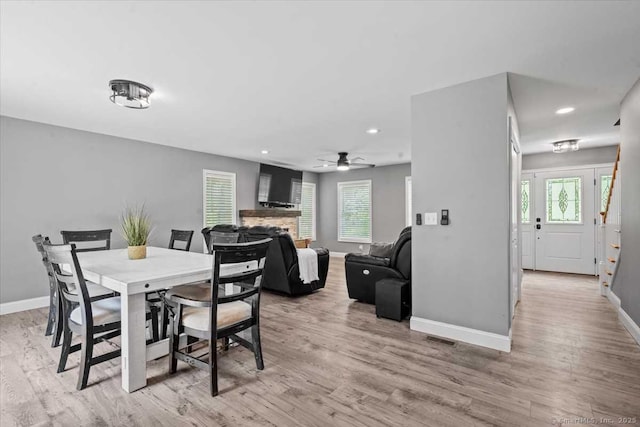 379 Tripp Hollow Rd, Brooklyn, CT 06234 - dining room featuring light wood-style floors, a fireplace, plenty of natural light, and recessed lighting
