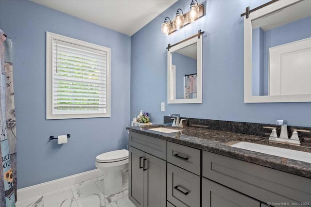 379 Tripp Hollow Rd, Brooklyn, CT 06234 - full bathroom with double vanity, marble finish floors, and a shower with shower curtain